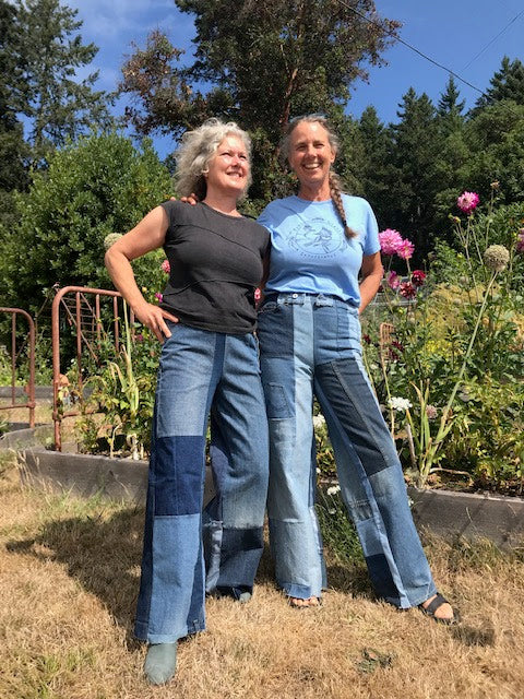 Two models wearing different washes of Heke Design upcycled jeans, demonstrating the versatility and inclusive sizing of our circular fashion collection.