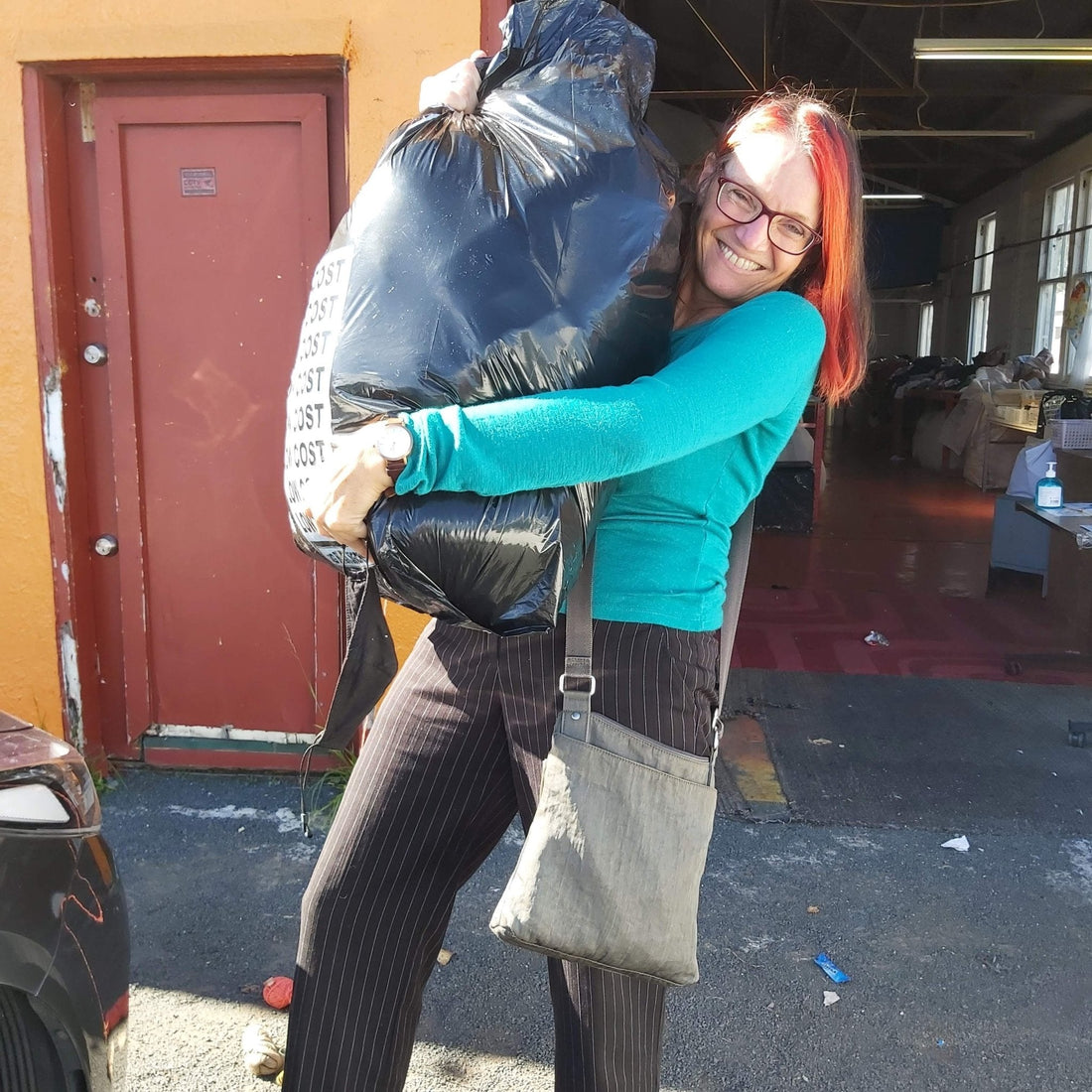 Bea Lorimer from Heke Design with a bag of textiles ready for recycling
