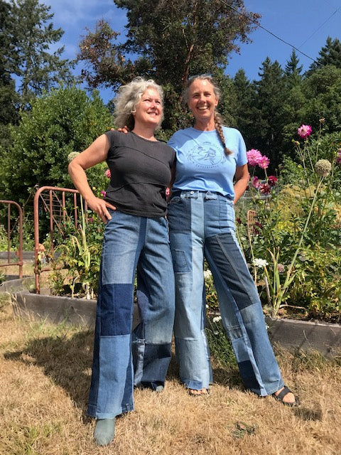 Two women wearing patchwork upcycled jeans