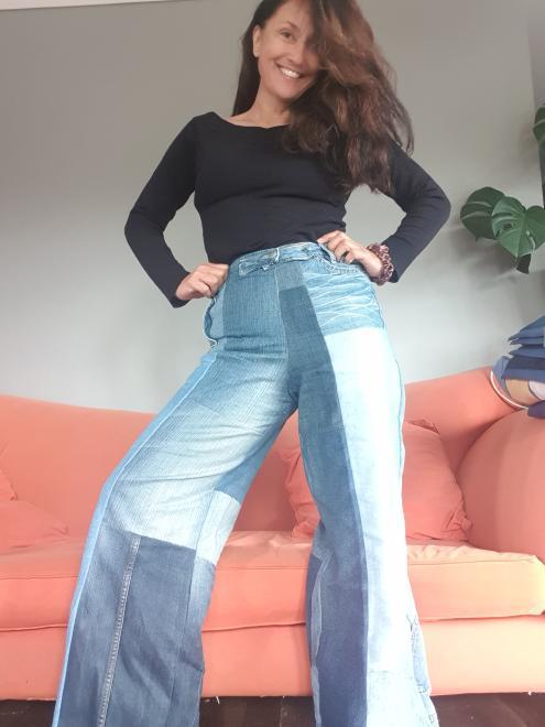 Woman in wide-legged patchwork jeans